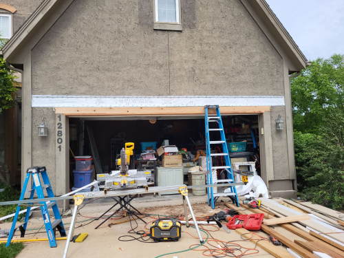 Work Benches Tools and Ladder Outside Garage
