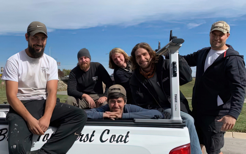 Town and Country Team in Front of Truck